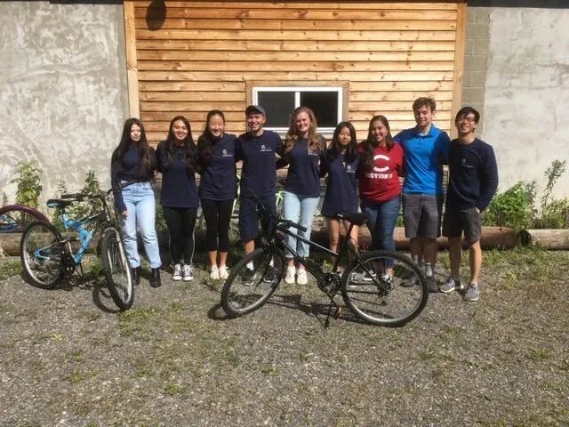 Student volunteers outside the bike workshop
